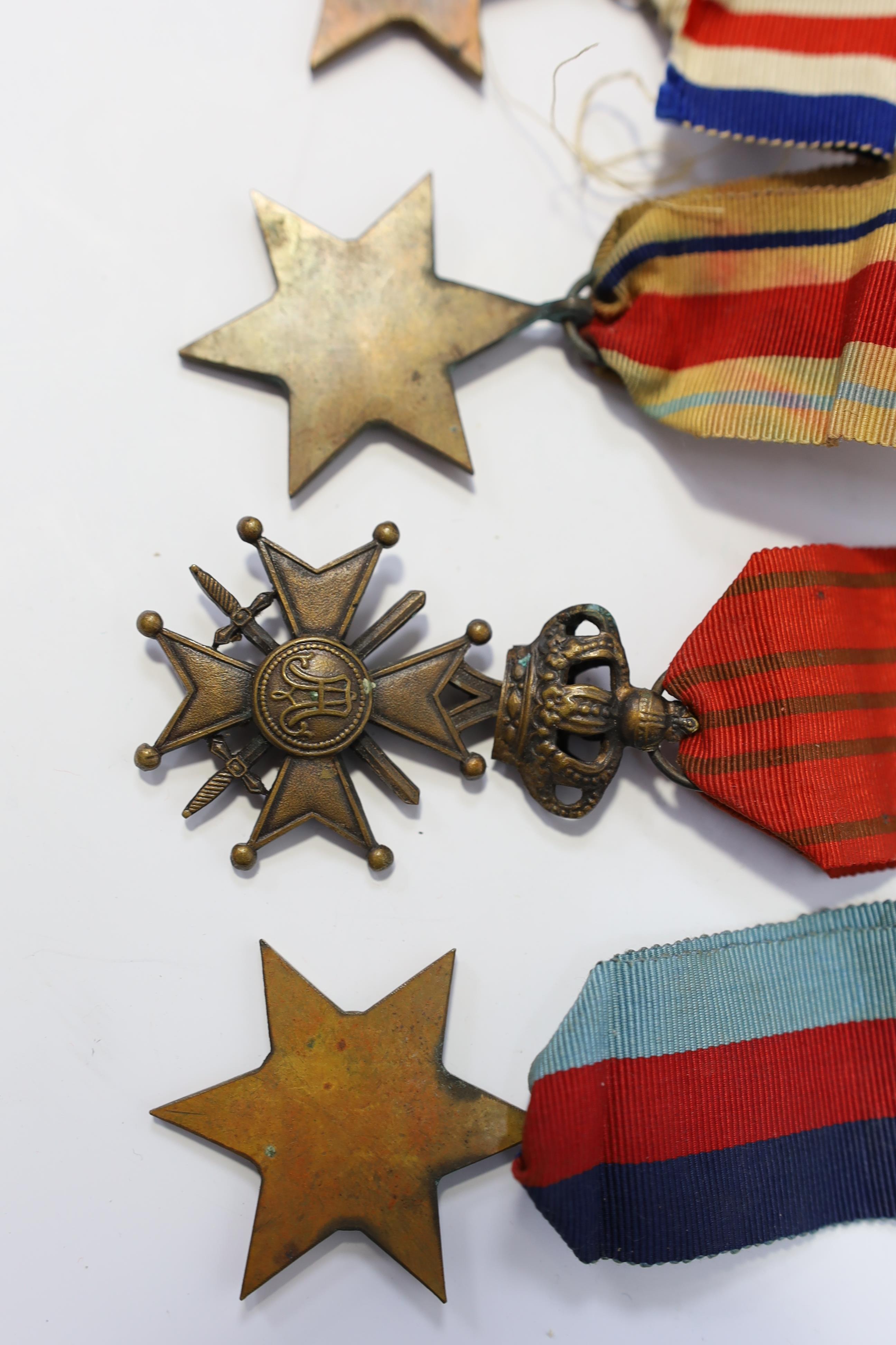 Seven medals including; a First World War British War Medal awarded to PTE. H. Lee DURH. L.I., A 1939-1945 medal, The Defence Medal, the Africa Star, the France and Germany Star, the 1939-1945 Star, plus a GPO cap badge.